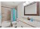 Well lit bathroom featuring granite countertops, tiled shower, and modern fixtures at 470 Pretty View Se Ln, Smyrna, GA 30082