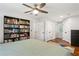Bedroom featuring hardwood floors and built-in bookshelf with neutral colored walls at 470 Pretty View Se Ln, Smyrna, GA 30082