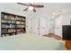 Bedroom featuring hardwood floors and built-in bookshelf with neutral colored walls at 470 Pretty View Se Ln, Smyrna, GA 30082