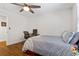 Cozy bedroom featuring a ceiling fan, hardwood floors, and plenty of natural light at 470 Pretty View Se Ln, Smyrna, GA 30082
