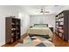 Bedroom with a ceiling fan, hardwood floors, and a contemporary decorative area rug at 470 Pretty View Se Ln, Smyrna, GA 30082