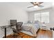 Comfortable bedroom with ceiling fan, hardwood floors, and natural light from the window at 470 Pretty View Se Ln, Smyrna, GA 30082