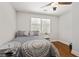 Well-lit bedroom showcasing a ceiling fan, hardwood floors, and a bright, airy atmosphere at 470 Pretty View Se Ln, Smyrna, GA 30082