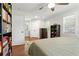 Bedroom featuring hardwood floors, a ceiling fan, and a contemporary decorative area rug at 470 Pretty View Se Ln, Smyrna, GA 30082