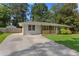 Charming single-story home with a well-manicured lawn, inviting porch, and long driveway at 470 Pretty View Se Ln, Smyrna, GA 30082