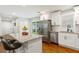 Bright kitchen features a breakfast bar island, stainless appliances, and classic white cabinets at 470 Pretty View Se Ln, Smyrna, GA 30082
