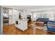 Open floor plan blends kitchen and living room, featuring a kitchen island and hardwood floors at 470 Pretty View Se Ln, Smyrna, GA 30082