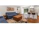 Open floor plan showcasing the bright living room flowing to kitchen with stainless appliances at 470 Pretty View Se Ln, Smyrna, GA 30082