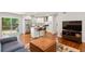 Bright open living space with hardwood floors, kitchen island, and stainless appliances at 470 Pretty View Se Ln, Smyrna, GA 30082