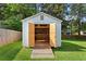 Exterior view of a shed featuring a ramp and open doors, perfect for storage at 470 Pretty View Se Ln, Smyrna, GA 30082