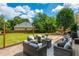 Relaxing backyard deck area complete with outdoor furniture, string lights, and views of the yard at 2000 Settindown Dr, Roswell, GA 30075