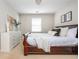 Comfortable bedroom with a large window and a dark wood sleigh bed at 2000 Settindown Dr, Roswell, GA 30075