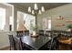 Dining room with stylish light fixture, dining table, and view of the stairs at 2000 Settindown Dr, Roswell, GA 30075