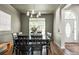 Inviting dining room with hardwood floors and a view to the home's entryway at 2000 Settindown Dr, Roswell, GA 30075