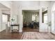Inviting entryway featuring a dark wood floor and an open view to the dining room at 2000 Settindown Dr, Roswell, GA 30075