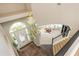 Open foyer with a grand chandelier and a staircase leading up to a cozy seating area at 2000 Settindown Dr, Roswell, GA 30075