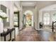 Spacious foyer with hardwood flooring, grand arched entrance, and ample natural light at 2000 Settindown Dr, Roswell, GA 30075