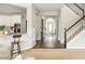 View of the foyer with hardwood floors and staircase leading to the upper level at 2000 Settindown Dr, Roswell, GA 30075
