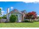 Well-maintained front yard with mature landscaping and charming exterior details at 2000 Settindown Dr, Roswell, GA 30075