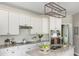 Updated kitchen features granite countertops, modern appliances, and ample cabinet space at 2000 Settindown Dr, Roswell, GA 30075