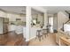 Open concept kitchen with stainless steel appliances and granite countertops flowing into the living area at 2000 Settindown Dr, Roswell, GA 30075
