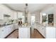 Modern kitchen with stainless steel appliances, granite countertops, and a cozy breakfast bar at 2000 Settindown Dr, Roswell, GA 30075