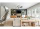 Cozy living room with fireplace, staircase, and a large sofa at 2000 Settindown Dr, Roswell, GA 30075