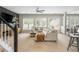 Spacious living room featuring a plush sectional and a view of the kitchen at 2000 Settindown Dr, Roswell, GA 30075