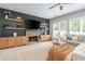 This is a living room that features built-ins around a gas fireplace at 2000 Settindown Dr, Roswell, GA 30075