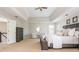 Spacious main bedroom with a tray ceiling, sitting area, and a luxurious king-sized bed at 2000 Settindown Dr, Roswell, GA 30075