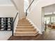 View of staircase leading to the second level and an open-concept living area at 2000 Settindown Dr, Roswell, GA 30075
