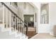 Elegant staircase with views into the dining room at 2000 Settindown Dr, Roswell, GA 30075