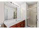 Neutral bathroom features a large mirror and glass shower stall at 2555 Flat Shoals Rd # 2006, Atlanta, GA 30349