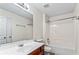 Bathroom has a large mirror and a combo tub and shower with white tile surround at 2555 Flat Shoals Rd # 2006, Atlanta, GA 30349