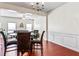 Dining area with elegant chandelier, glass table, and an open layout to living room at 2555 Flat Shoals Rd # 2006, Atlanta, GA 30349