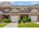 Charming brick townhome with attached garage and well-maintained landscaping at 2555 Flat Shoals Rd # 2006, Atlanta, GA 30349