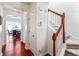 Hallway with hardwood flooring, staircase and dining area featuring chandelier at 2555 Flat Shoals Rd # 2006, Atlanta, GA 30349