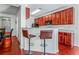 An open kitchen and breakfast bar features granite countertops and stainless steel appliances at 2555 Flat Shoals Rd # 2006, Atlanta, GA 30349