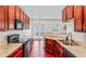 A kitchen features granite countertops, cherry cabinets, and modern appliances at 2555 Flat Shoals Rd # 2006, Atlanta, GA 30349