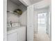 Laundry room with full-sized washer and dryer is adjacent to the bedroom at 2555 Flat Shoals Rd # 2006, Atlanta, GA 30349