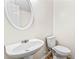 Simple and clean half bathroom with a pedestal sink and toilet at 2555 Flat Shoals Rd # 2006, Atlanta, GA 30349