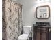 Bathroom with a vanity sink, framed mirror, and patterned shower curtain at 420 Heritage Park Nw Trce # 22, Kennesaw, GA 30144
