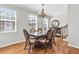Elegant dining room with hardwood floors and classic chandelier at 420 Heritage Park Nw Trce # 22, Kennesaw, GA 30144