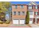 Attractive two-story brick townhome with two-car garage and manicured landscaping at 420 Heritage Park Nw Trce # 22, Kennesaw, GA 30144