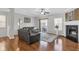 Comfortable living room with fireplace, hardwood floors, and natural light at 420 Heritage Park Nw Trce # 22, Kennesaw, GA 30144