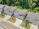 Aerial view of the home showing surrounding neighborhood, mature trees, and meticulous landscaping at 461 Maypop Ln, Woodstock, GA 30188