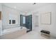 Luxurious bathroom featuring a soaking tub, glass-enclosed shower, and neutral finishes at 461 Maypop Ln, Woodstock, GA 30188
