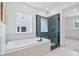 Spa-like bathroom featuring a soaking tub, glass-enclosed shower, and modern fixtures at 461 Maypop Ln, Woodstock, GA 30188