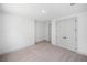 Spacious bedroom with plush carpet and double door closet at 461 Maypop Ln, Woodstock, GA 30188