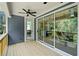Charming deck with ceiling fan, offering a relaxing outdoor space with views of the surrounding nature at 461 Maypop Ln, Woodstock, GA 30188